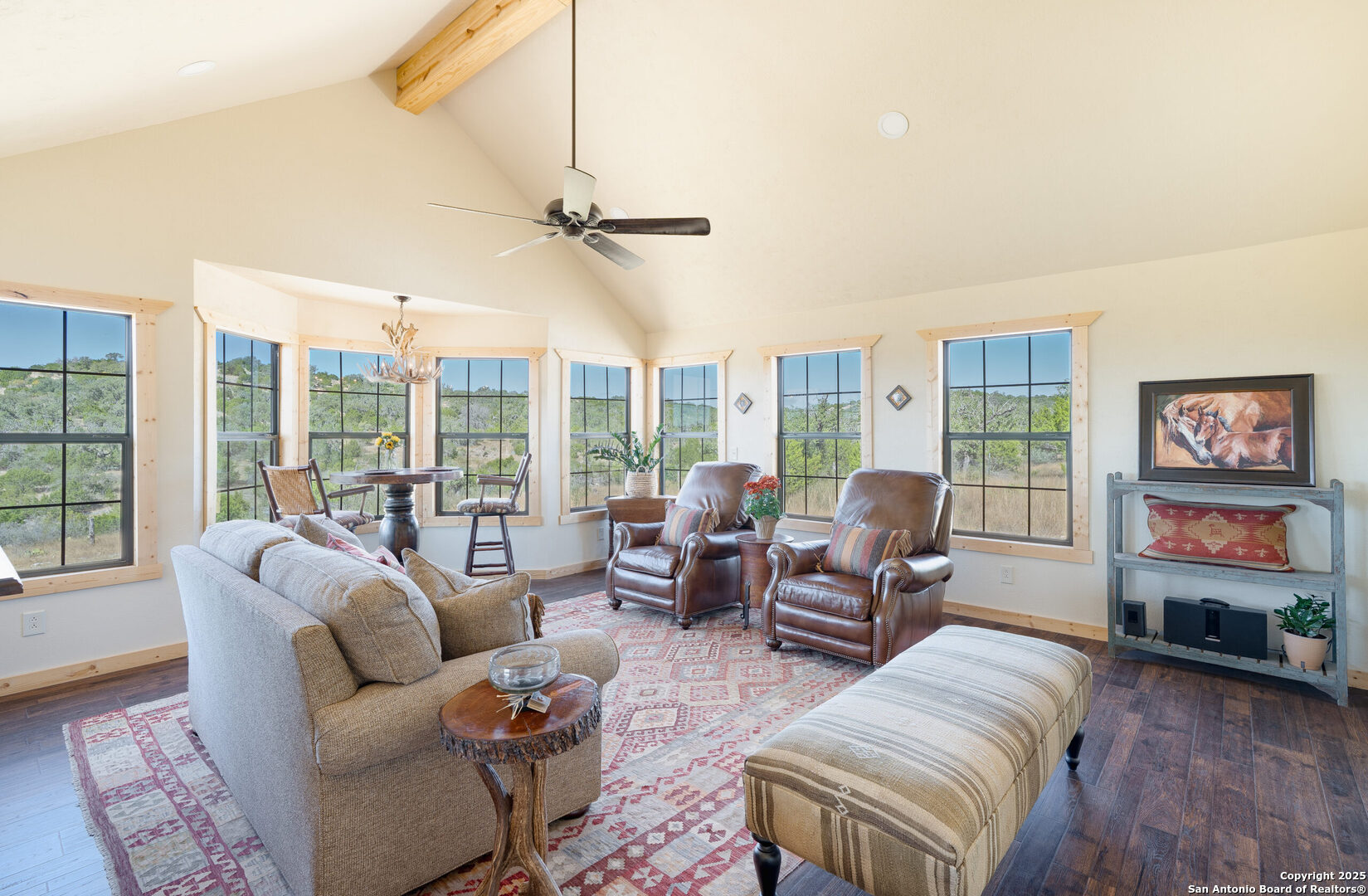 300 County Road 550 Rocksprings, TX 78880 - Photo 14 of 32 a living room with furniture large window and wooden floor