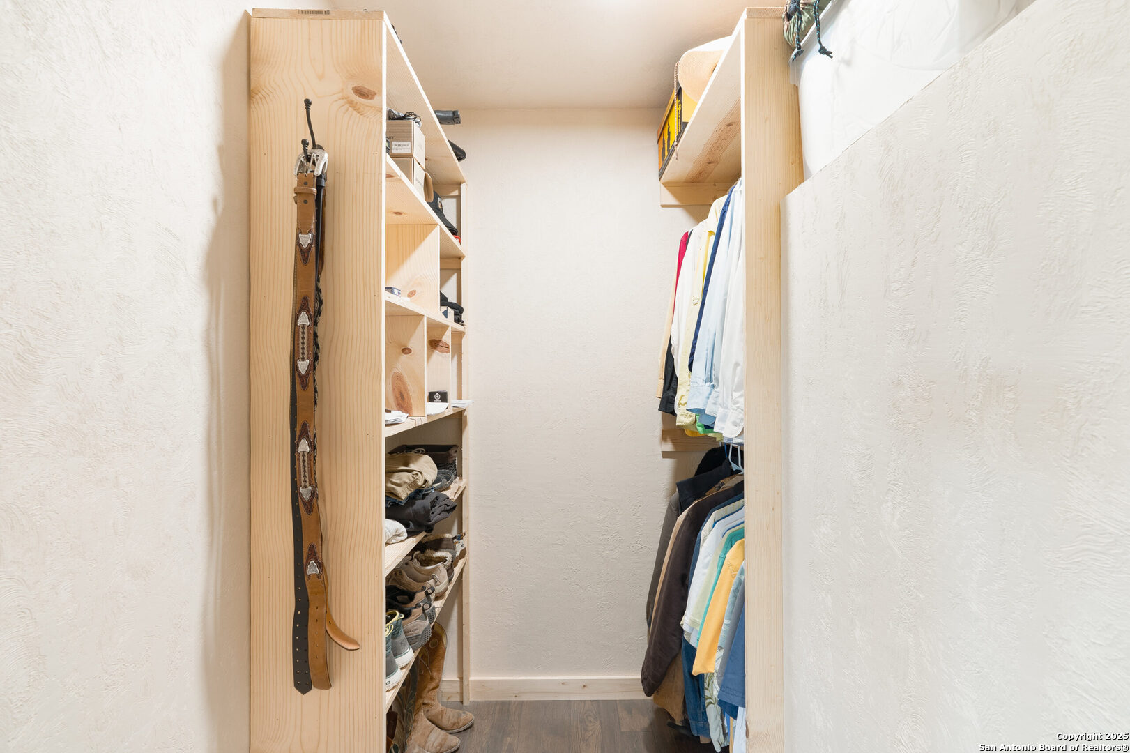 300 County Road 550 Rocksprings, TX 78880 - Photo 15 of 32 a view of walk in closet with clothes and shoes