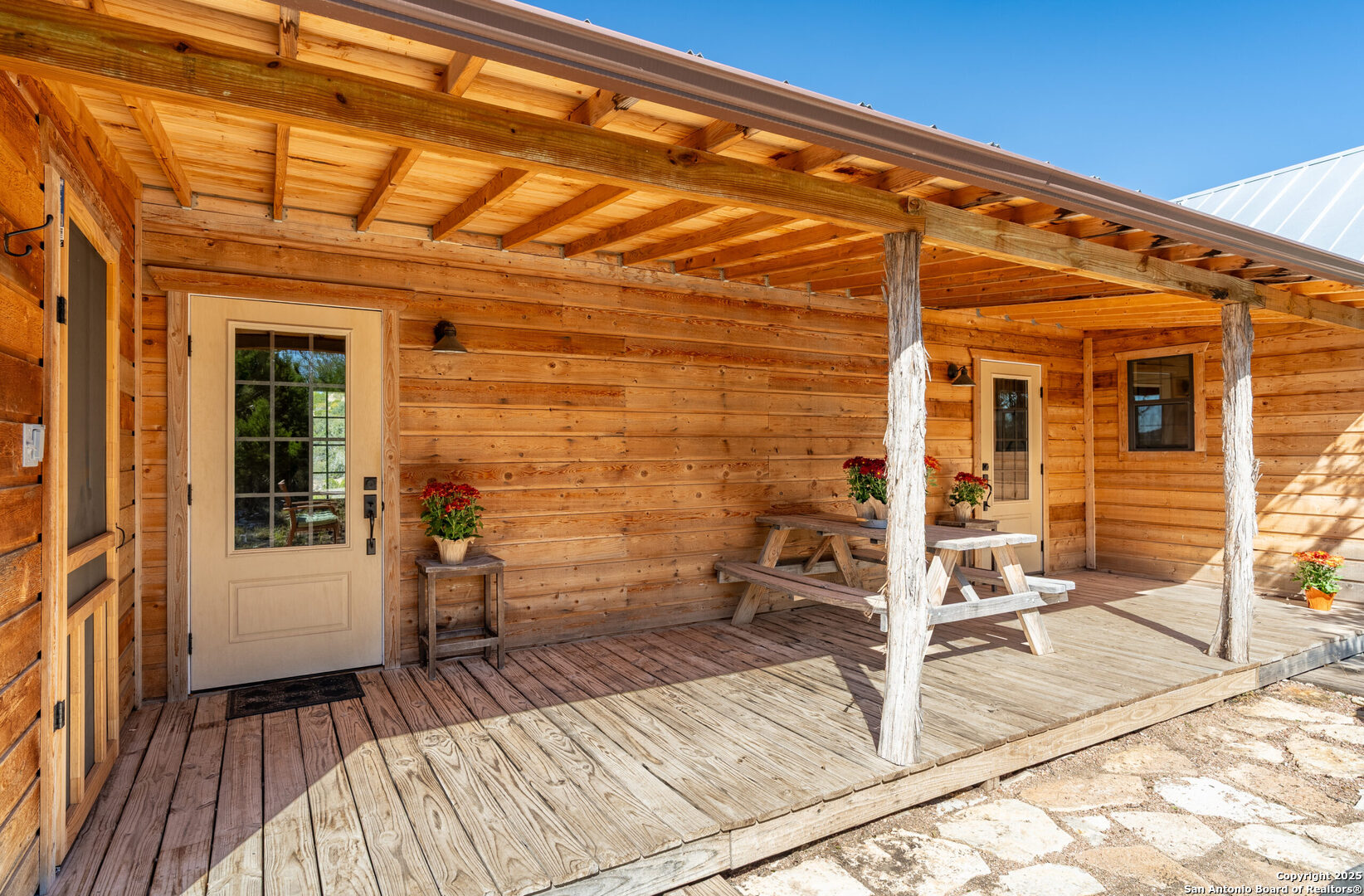 300 County Road 550 Rocksprings, TX 78880 - Photo 17 of 32 a view of a balcony with wooden floor and furniture