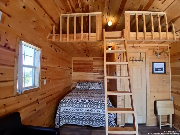 a kitchen with refrigerator and cabinets