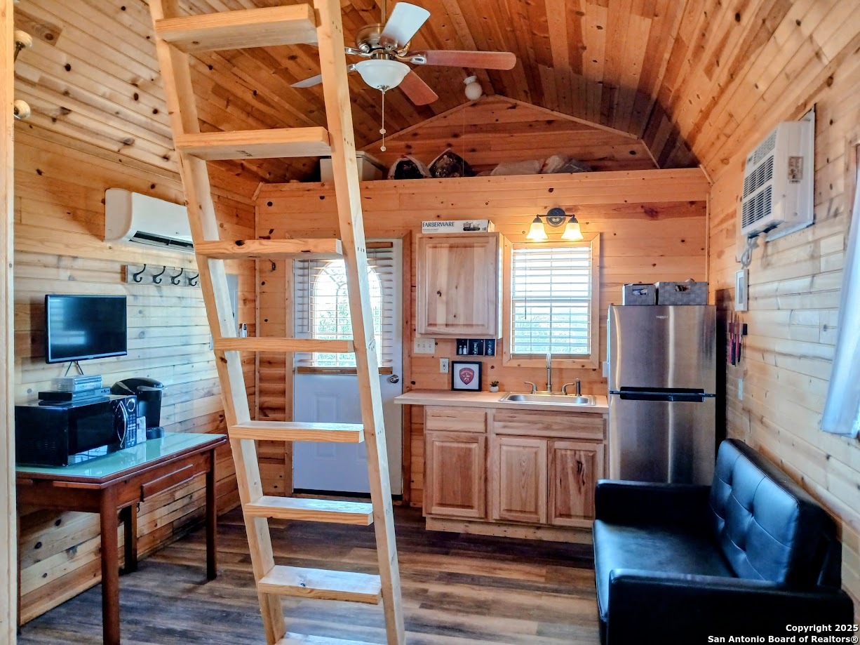 300 County Road 550 Rocksprings, TX 78880 - Photo 28 of 32 a kitchen with refrigerator and cabinets