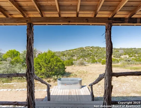 a view of a balcony with wooden floor