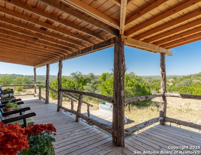 300 County Road 550 Rocksprings, TX 78880 - Photo 4 of 32 a view of a balcony with wooden floor