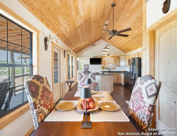 a bathroom with a granite countertop sink a toilet and a mirror