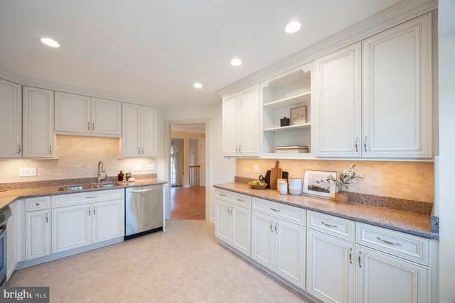 a kitchen that has a sink and cabinets
