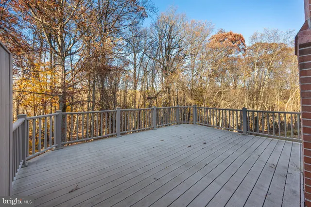 a view of wooden floor with a bench