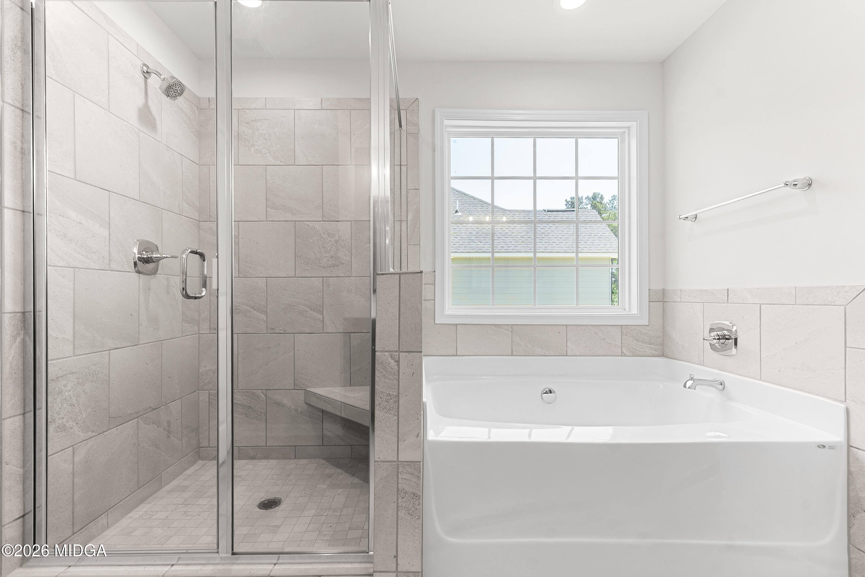 5393 Felles Way, Unit 359 Forsyth, GA 31029 - Photo 35 of 54 a bathroom with a bathtub and shower
