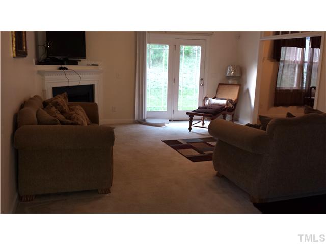 3621 Eastern Branch Road Raleigh, NC 27610 - Photo 3 of 3 a living room with furniture and a flat screen tv