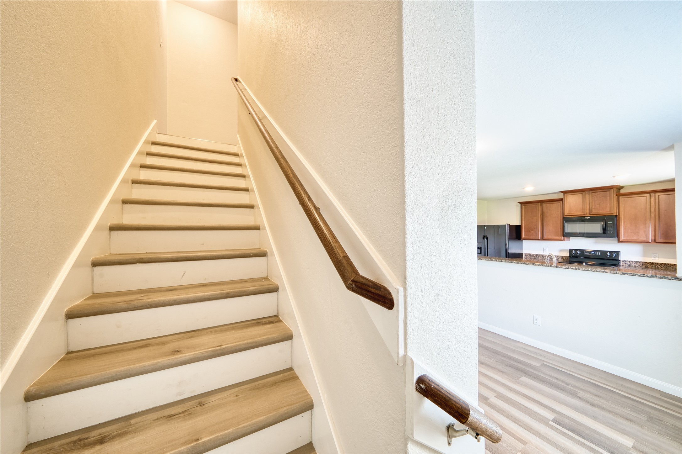 5735 Rainbow Rd. Cove, TX 77523 - Photo 11 of 22 Stairs leads to the secondary rooms.