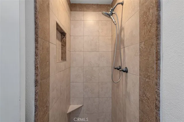a bathroom with a glass shower door