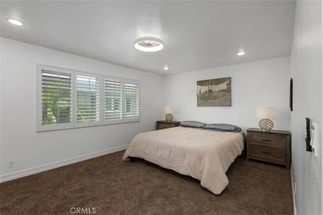 a bedroom with a bed and a table