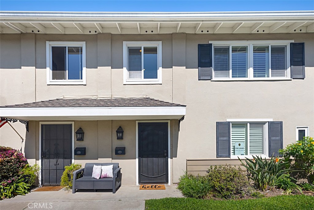 1741 Tustin Avenue, Unit 17C Costa Mesa, CA 92627 - Photo 2 of 36 a view of a building with potted plants