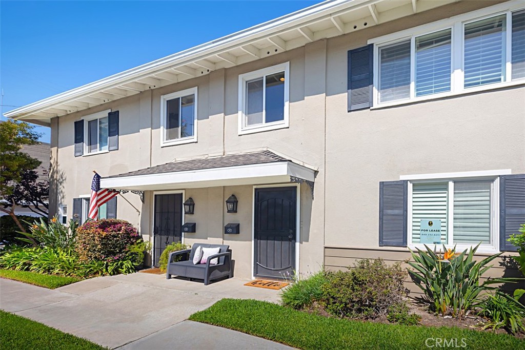 1741 Tustin Avenue, Unit 17C Costa Mesa, CA 92627 - Photo 3 of 36 a front view of a house with garden