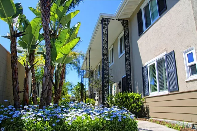 a view of a house with a flower garden