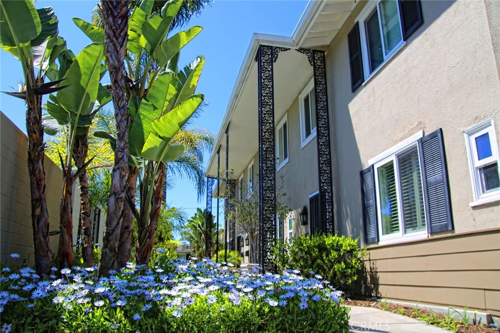 1741 Tustin Avenue, Unit 17C Costa Mesa, CA 92627 - Photo 31 of 36 a view of a house with a flower garden