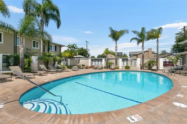 a view of a swimming pool with chairs