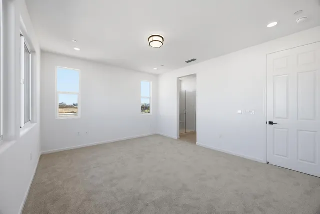a bathroom with a granite countertop sink a mirror and a shower