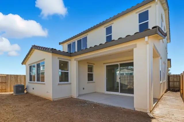 a view of an empty room with a fireplace