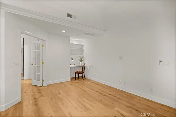 a view of a storage & utility room with closet window