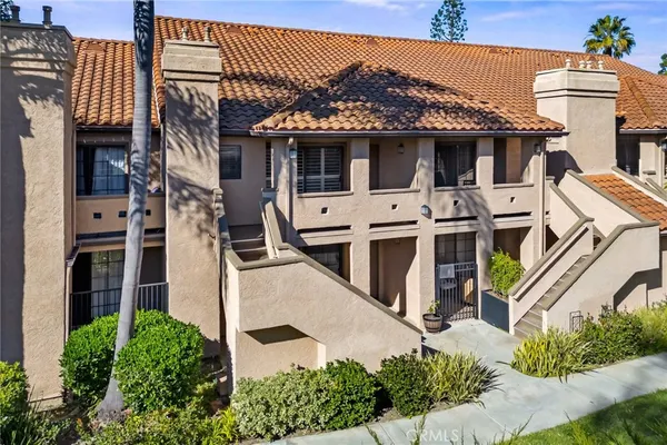 an aerial view of a houses with outdoor space