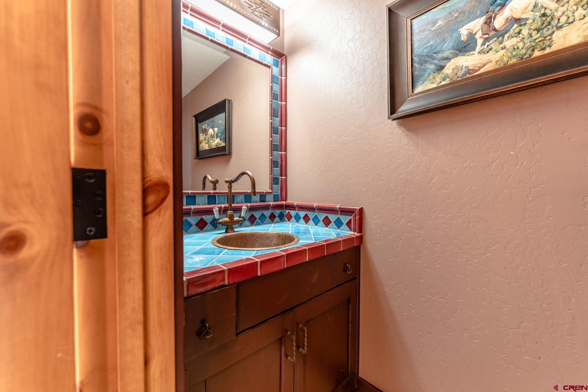 16 Snowmass Road, Unit 4 Crested Butte, CO 81225 - Photo 16 of 35 a bathroom with a sink and a mirror
