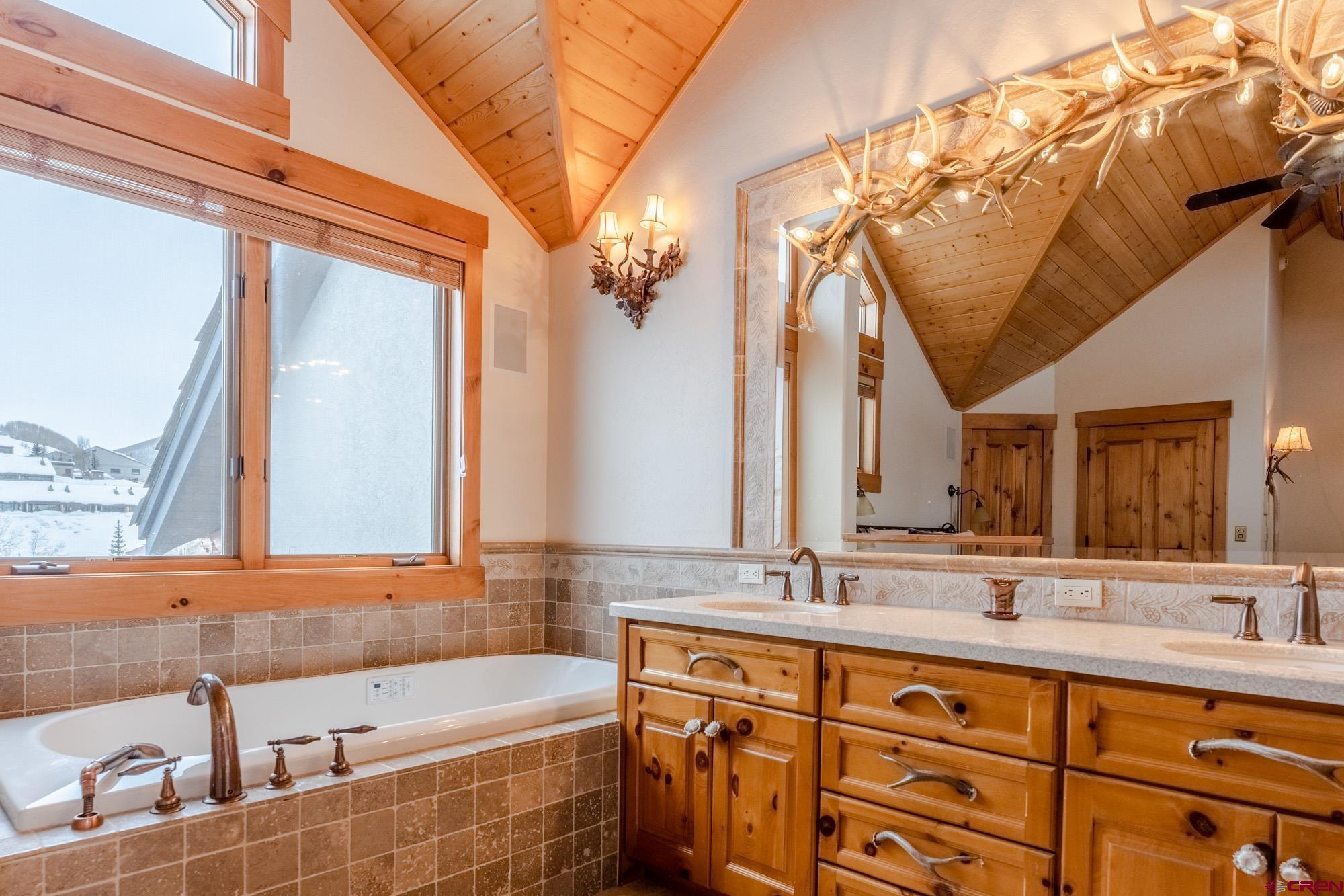 16 Snowmass Road, Unit 4 Crested Butte, CO 81225 - Photo 22 of 35 a bathroom with a sink and a mirror