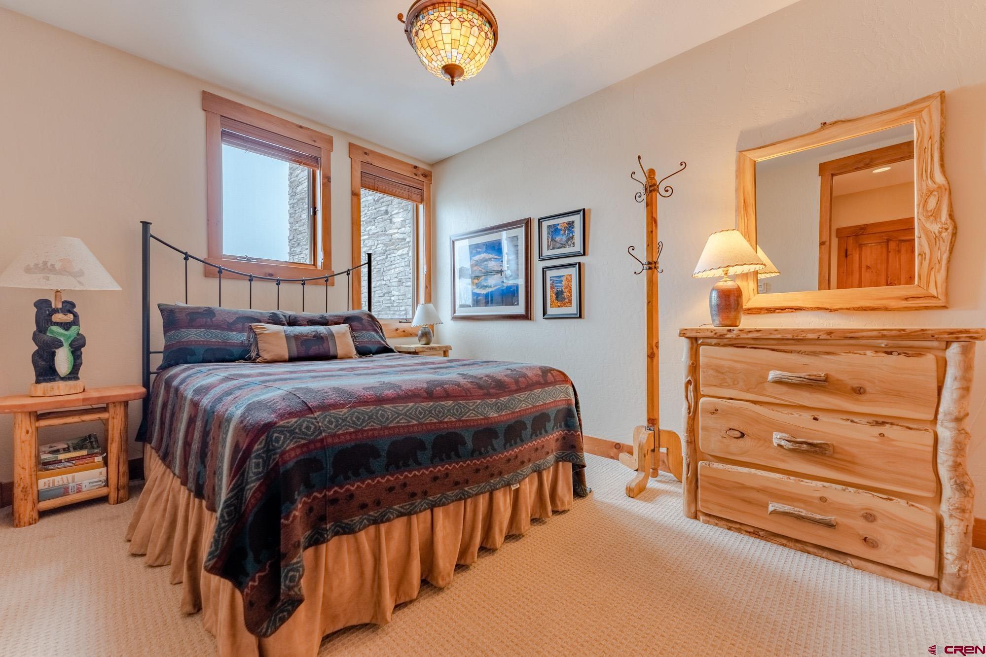 16 Snowmass Road, Unit 4 Crested Butte, CO 81225 - Photo 28 of 35 a bedroom with a bed and a window