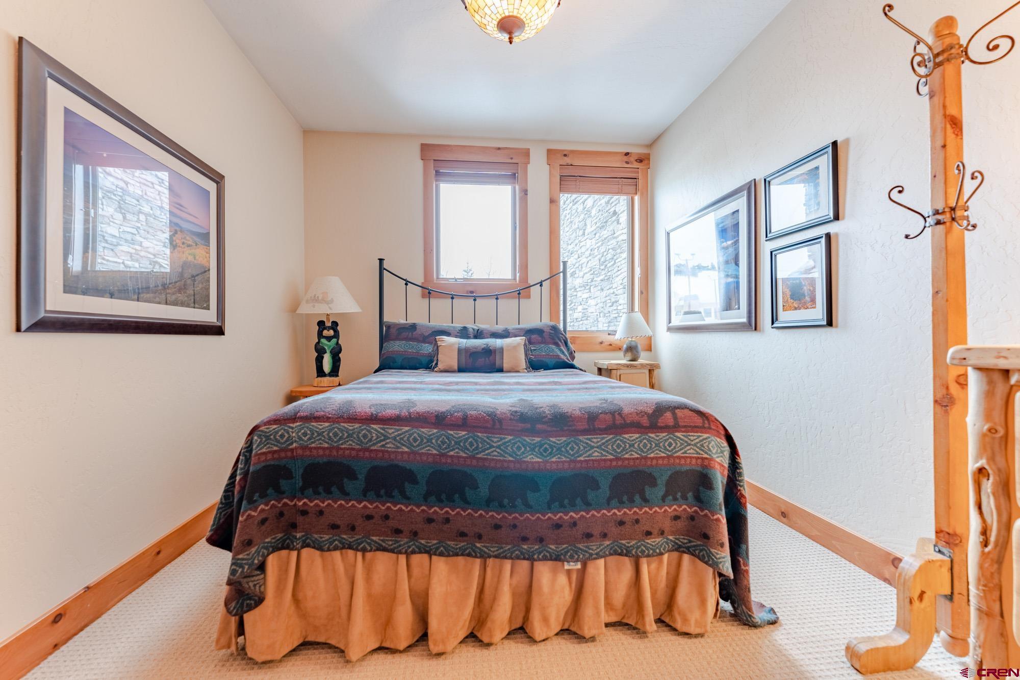 16 Snowmass Road, Unit 4 Crested Butte, CO 81225 - Photo 29 of 35 a bedroom with a bed and window