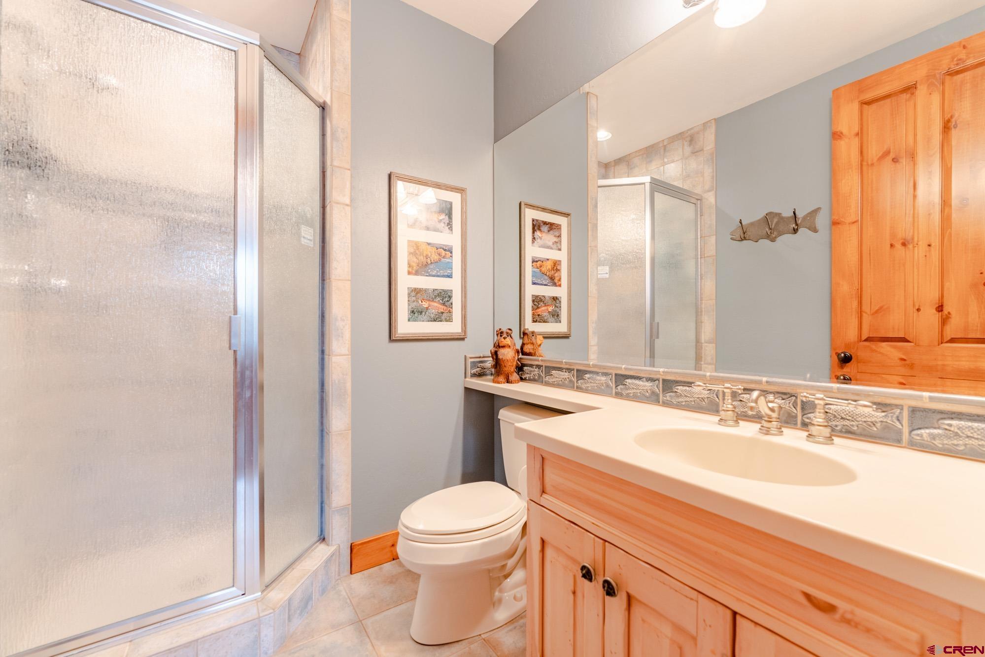 16 Snowmass Road, Unit 4 Crested Butte, CO 81225 - Photo 30 of 35 a bathroom with a granite countertop sink toilet and shower