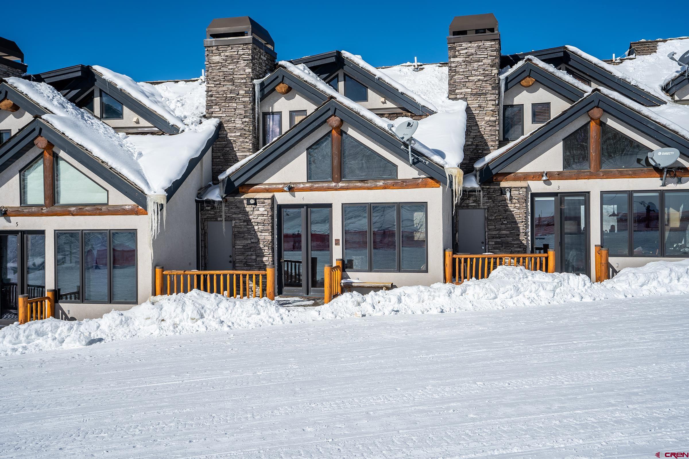 16 Snowmass Road, Unit 4 Crested Butte, CO 81225 - Photo 3 of 35 a view of a house with a outdoor space