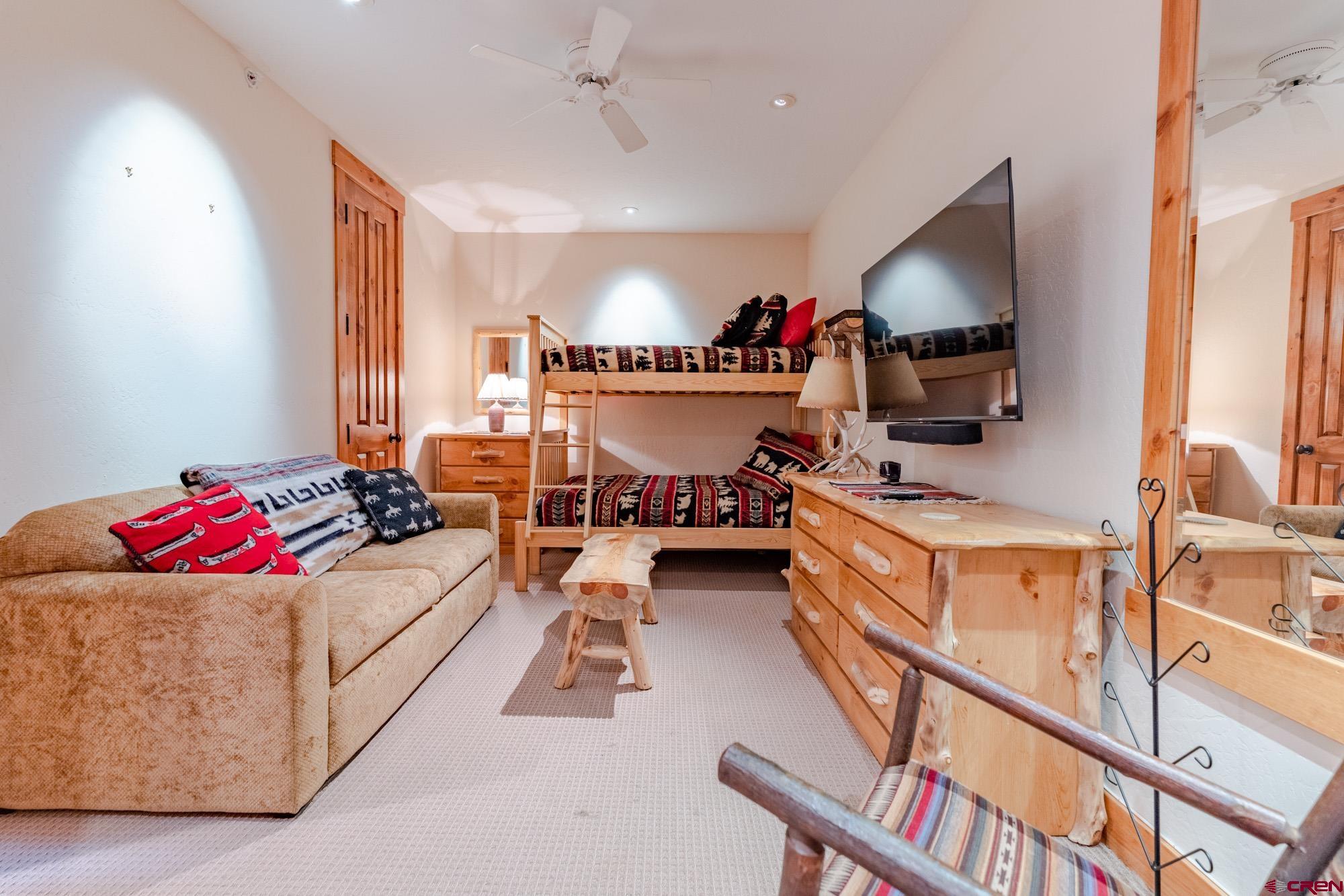 16 Snowmass Road, Unit 4 Crested Butte, CO 81225 - Photo 34 of 35 a living room with furniture and a flat screen tv