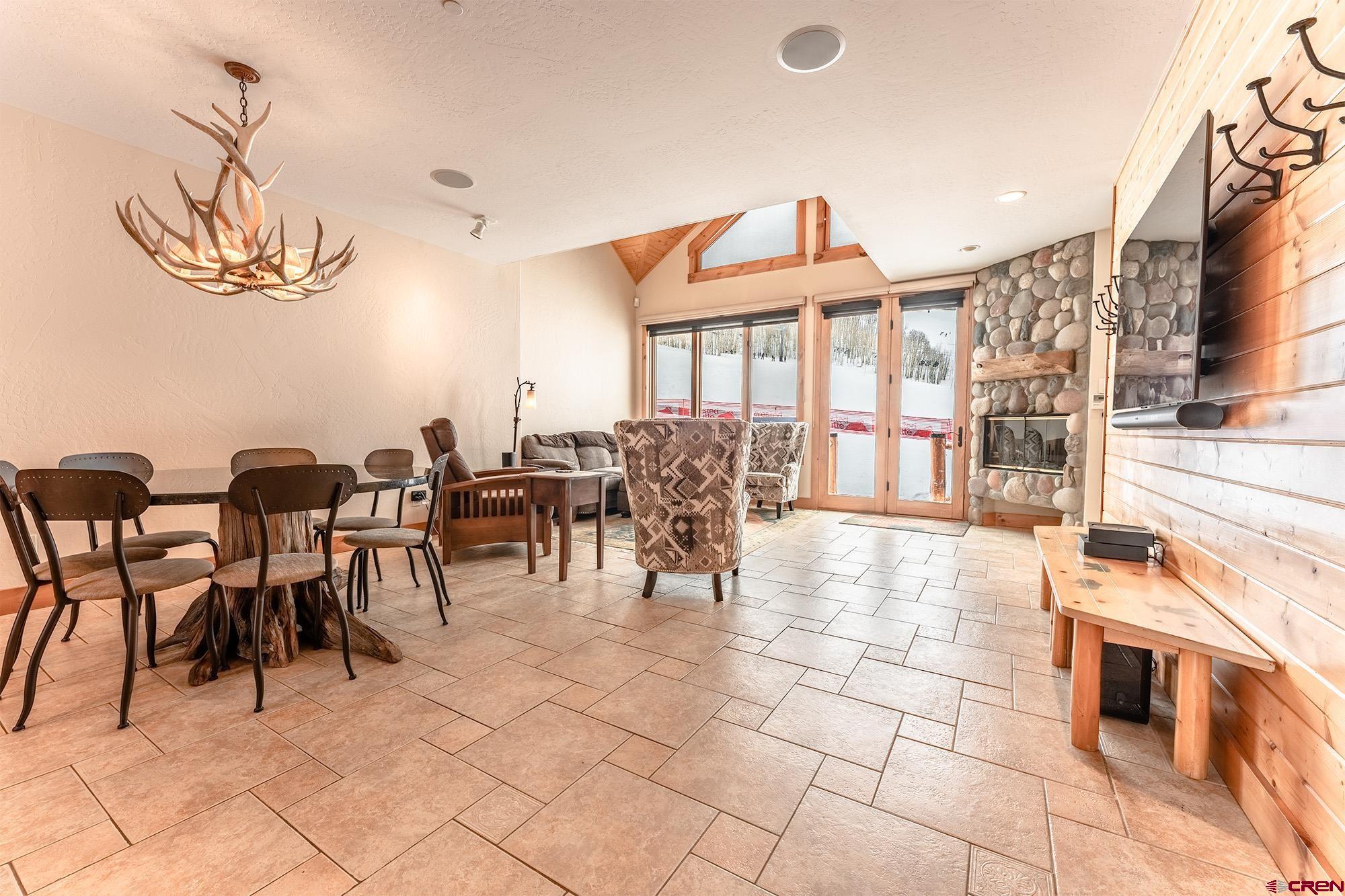 16 Snowmass Road, Unit 4 Crested Butte, CO 81225 - Photo 4 of 35 a view of a dining room with furniture