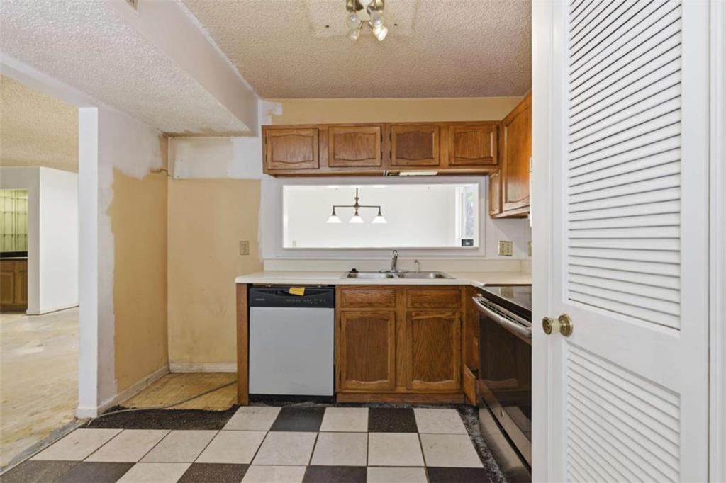 1980 Variations Drive Northeast Atlanta, GA 30329 - Photo 13 of 26 a kitchen with stainless steel appliances granite countertop a refrigerator and a stove