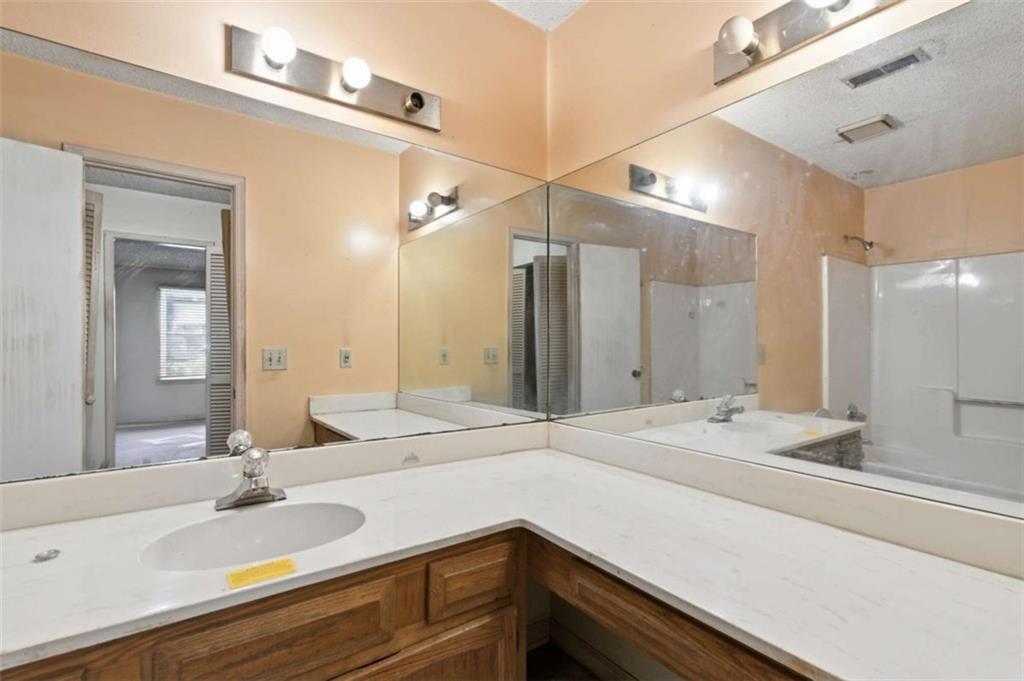 1980 Variations Drive Northeast Atlanta, GA 30329 - Photo 18 of 26 a bathroom with a sink and a mirror