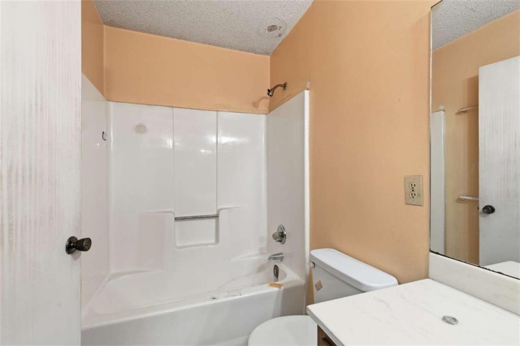 1980 Variations Drive Northeast Atlanta, GA 30329 - Photo 19 of 26 a bathroom with a bathtub and a shower