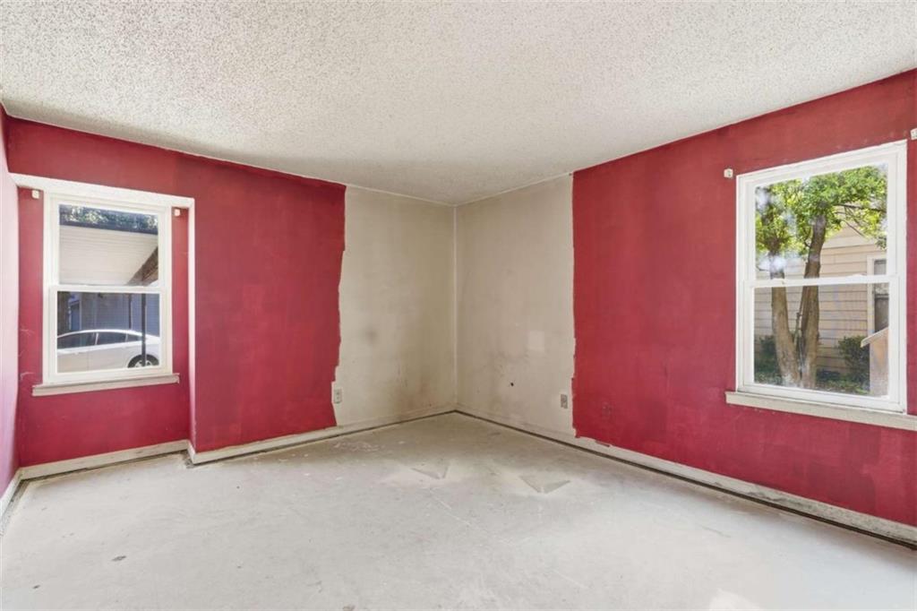 1980 Variations Drive Northeast Atlanta, GA 30329 - Photo 20 of 26 an empty room with windows and closet