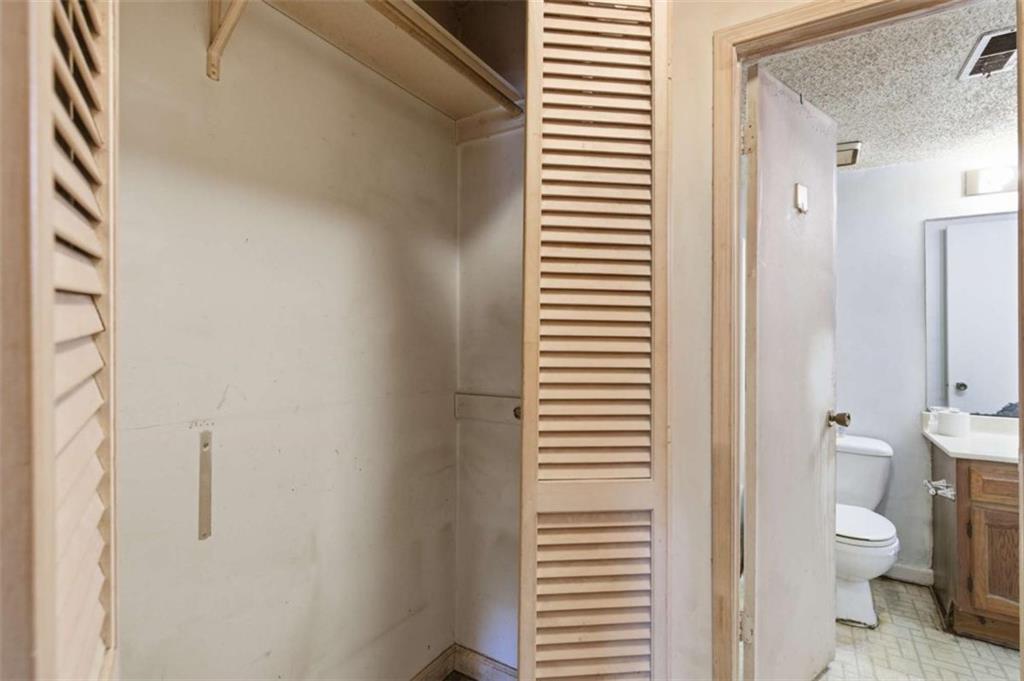 1980 Variations Drive Northeast Atlanta, GA 30329 - Photo 23 of 26 a bathroom with a toilet a sink and a window
