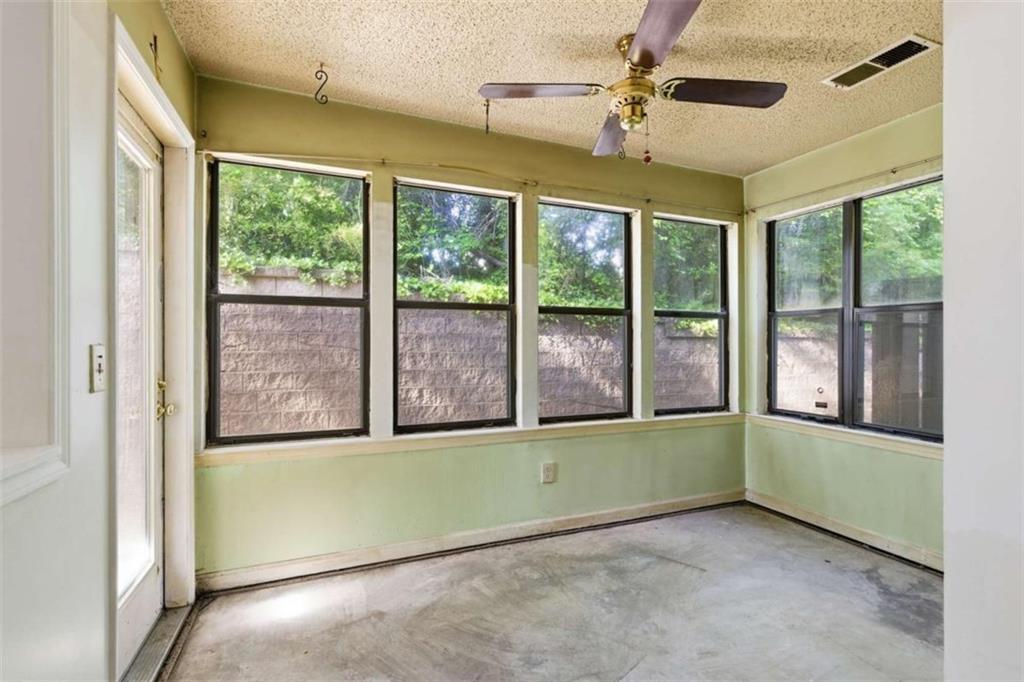 1980 Variations Drive Northeast Atlanta, GA 30329 - Photo 10 of 26 an empty room with a window and a ceiling fan