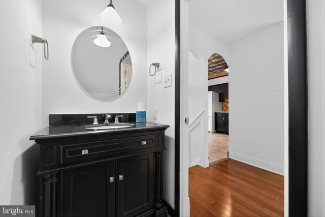 a kitchen with a sink and a mirror