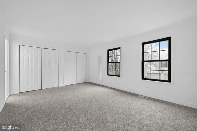 an empty room with windows