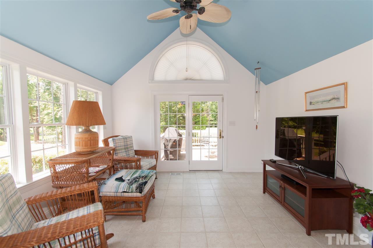 Access huge deck from the vaulted sun room