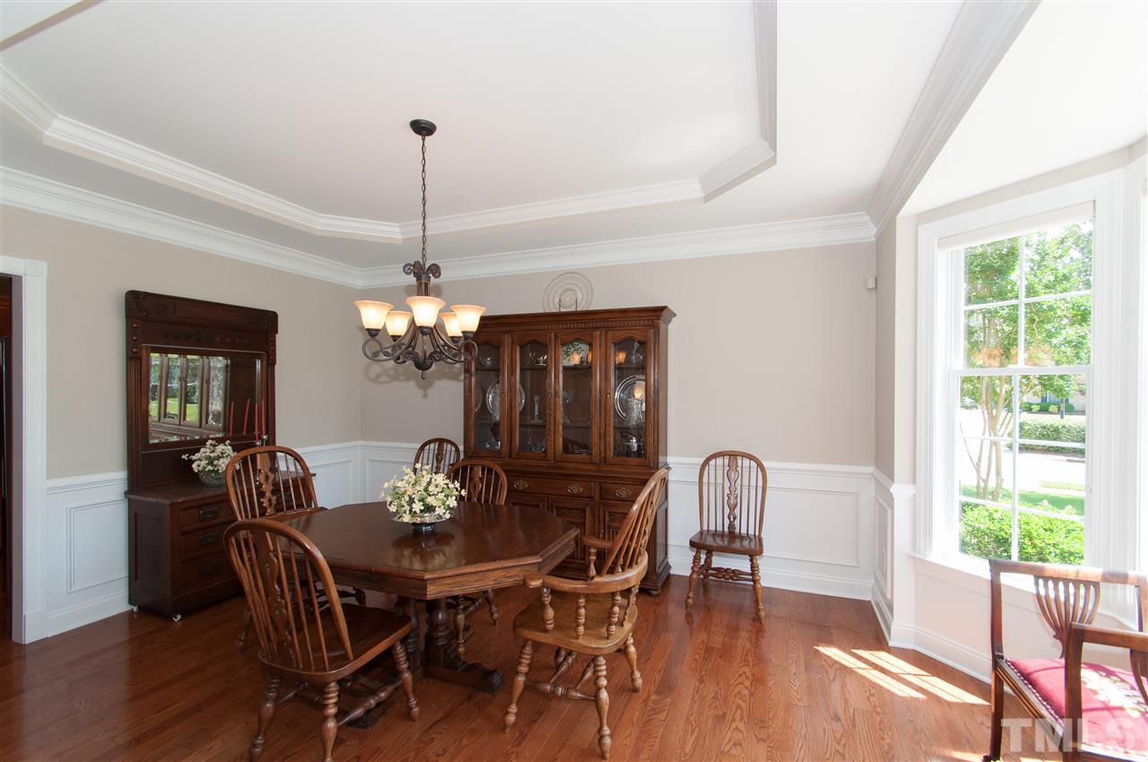 Formal dining room can hold a very large table. Hardwood floors, trey ceilings and style. Upgraded lighting