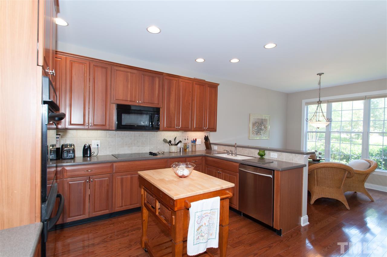 9515 Brookchase Drive Raleigh, NC 27617 - Photo 9 of 24 Upgraded cabinets. Double ovens, pantry and solid surface counter tops