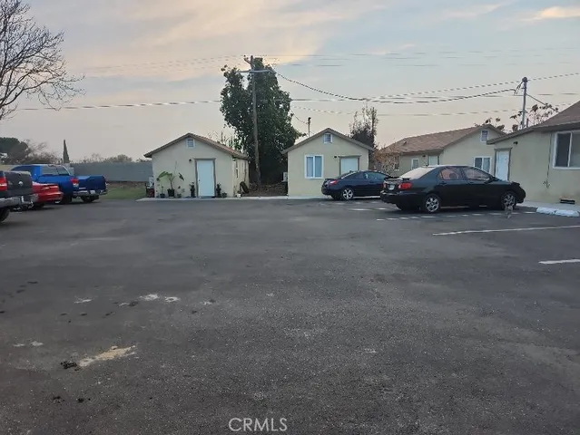 a view of a car park in front of house