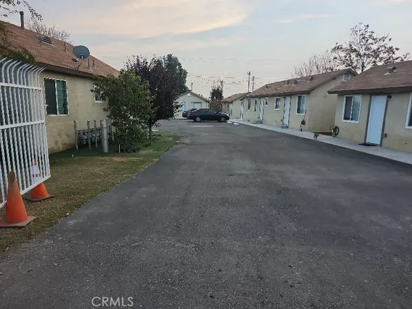 a view of a house with a yard and garage