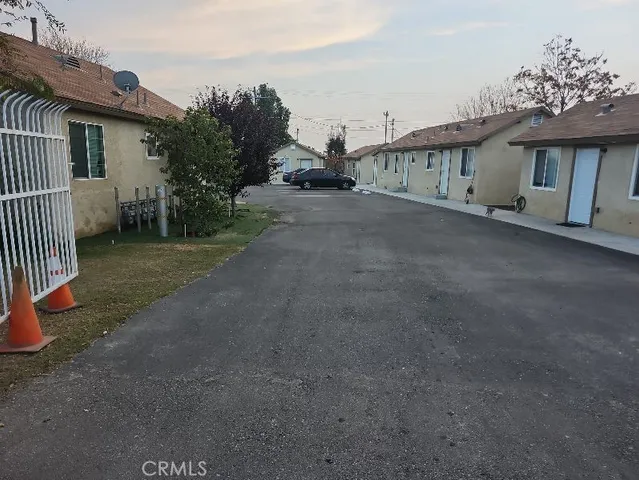 a view of a house with a yard and garage