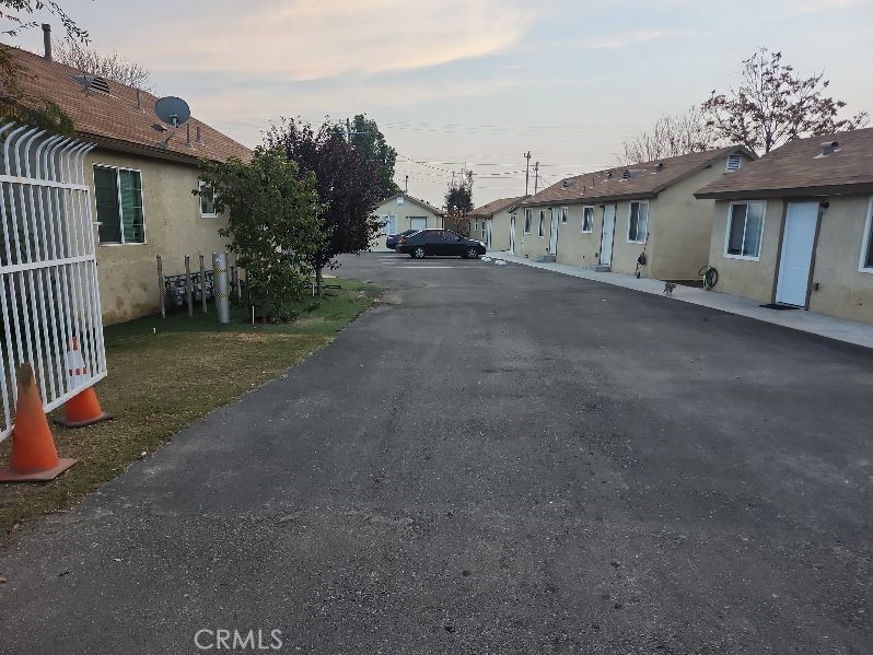 2915 Edison Highway Bakersfield, CA 93307 - Photo 2 of 21 a view of a house with a yard and garage