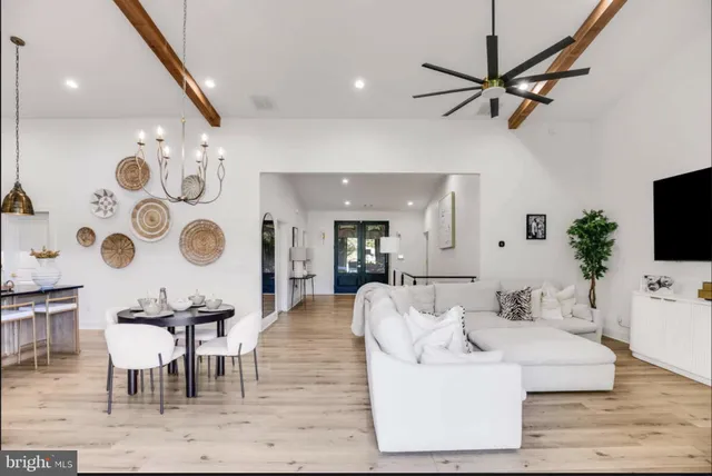a bedroom with furniture and a potted plant