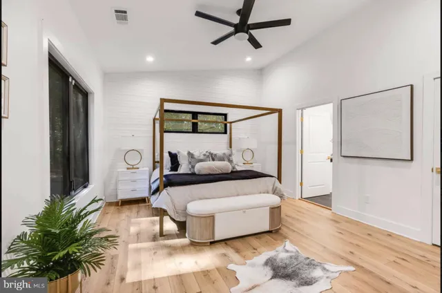 a view of a green field with mountains in the background