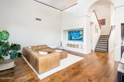 a living room with furniture and a potted plant